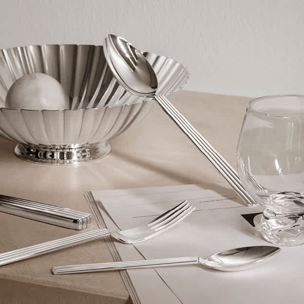 Cutlery and bowl in sterling silver designed by Sigvard Bernadotte