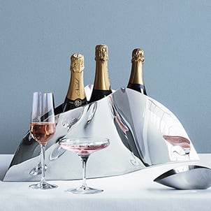 Champagne glasses and champagne cooler from the Indulgence collection by Georg Jensen"