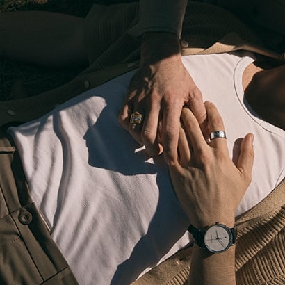 three set Fusion rings in 18 karat yellow gold and rose gold on woman's hand and two set fusion ring in 18 karat white gold on man's hands by georg jensen