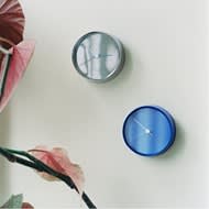 Clocks in stainless steel and glass designed by Henning Koppel