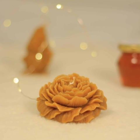Espelma de cera d'abella en forma de rosa