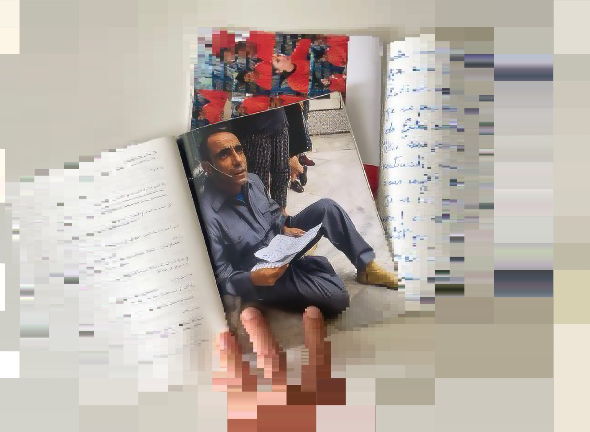 Two open books lie on a light-colored table and are held by three fingers. The pages contain pictures of people and handwritten texts.