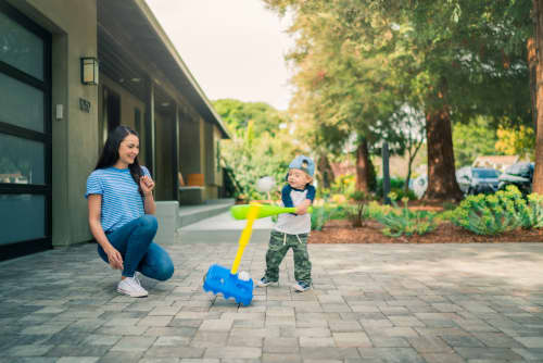 mother and son playing tee ball