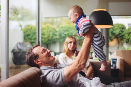 grandfather-holding-child