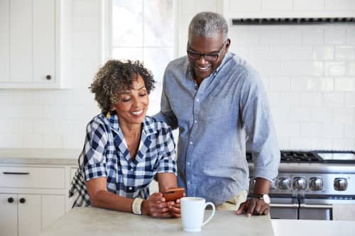 Older couple looking at phone