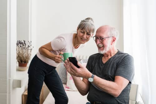 older couple looking at phone