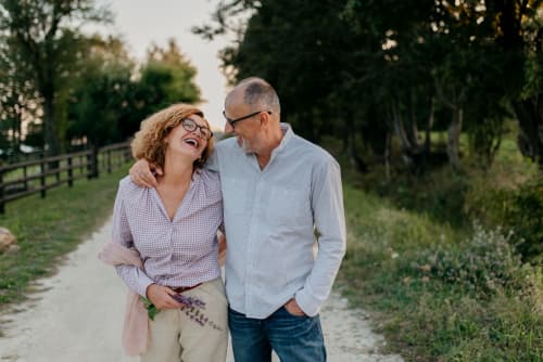 Older couple walking down path