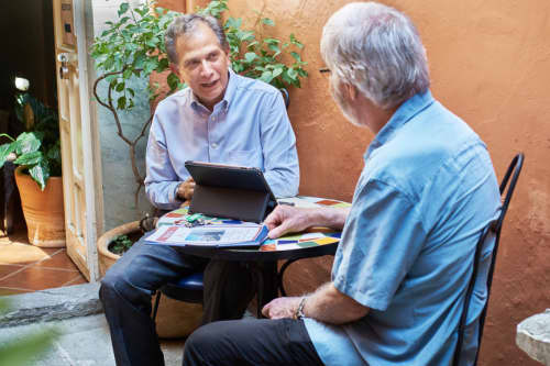 men speaking in coffeeshop