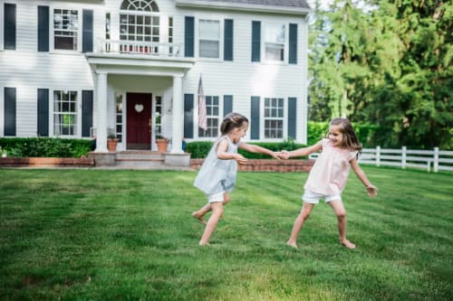 kids playing in front of home