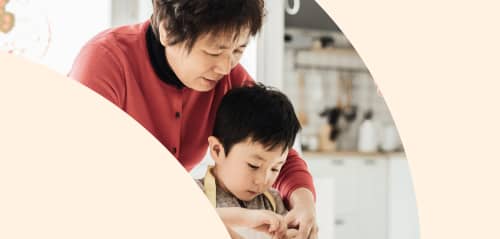 grandmother and grandson cooking