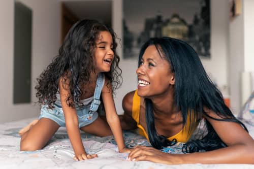 Mother and daughter laughing