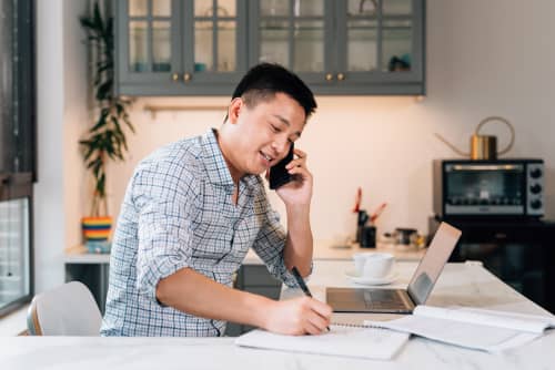 Man looking at computer on the phone