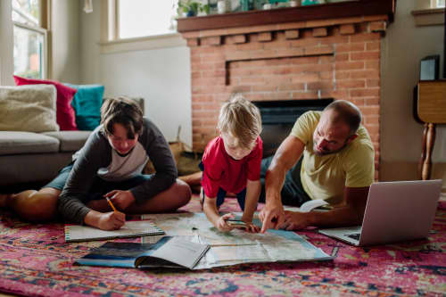 father and sons playing a game