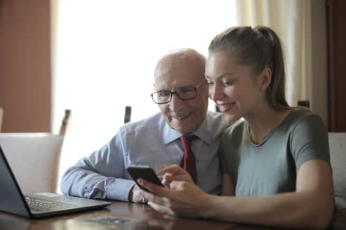 grown daughter talking to older father