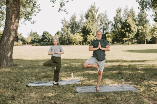 Older couple practicing yoga