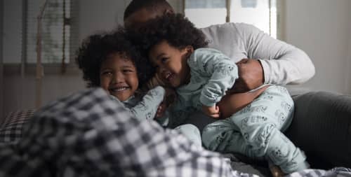 father and kids playing 