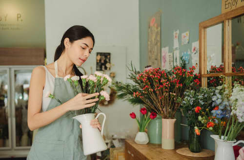 Business owner working with flowers for an arrangement