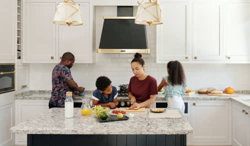 family together cooking in kitchen