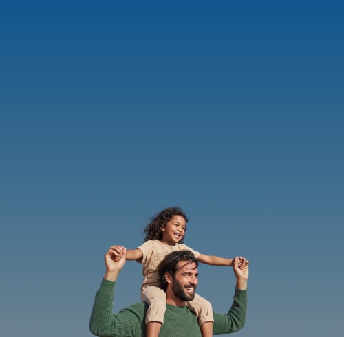 Parent carrying child in blue sky
