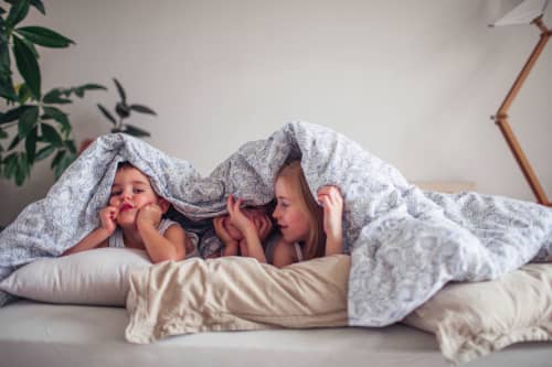 kids playing under covers