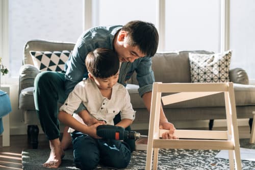 dad and son building