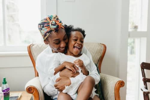 mom laughing with daughter