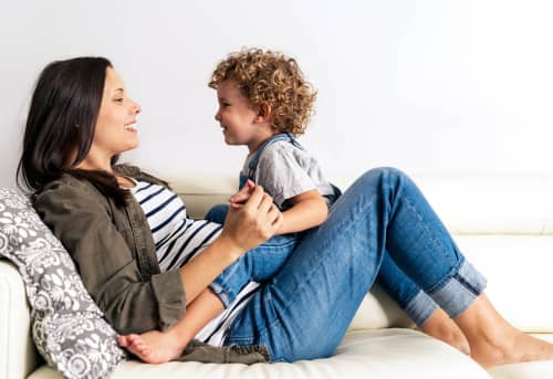 Mother and child sitting together