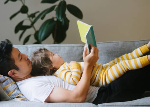 Father reading to his child