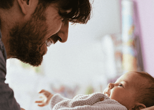 father holding his baby