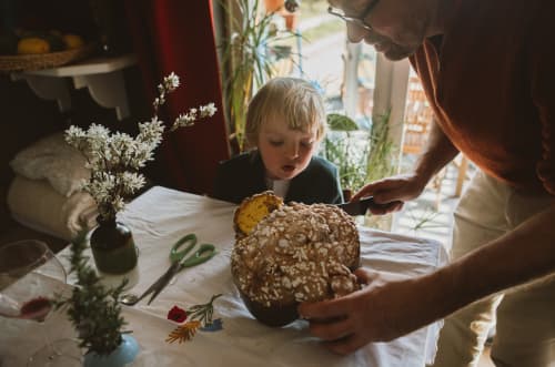 Man-slicing-bread-for-child