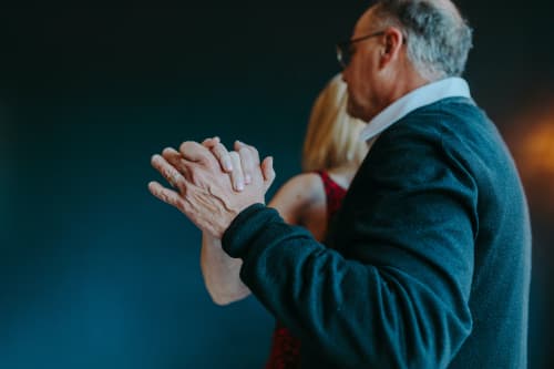 middle-aged couple slow dancing