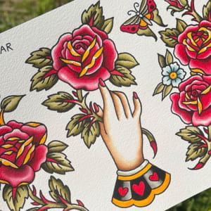 Image of Hand holding rose