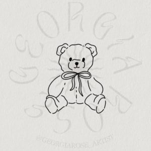 Image of teddy bear with bow (~3-4cm)