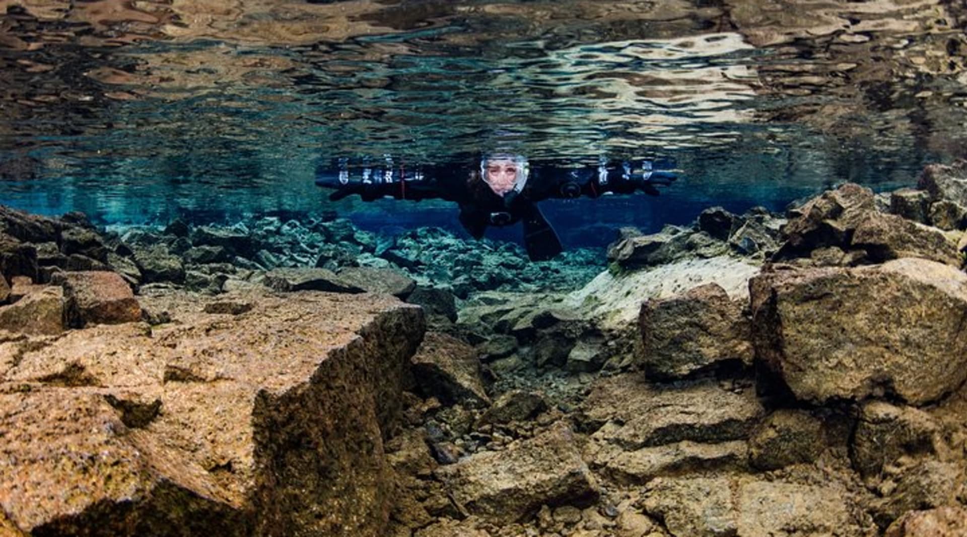 Snorkelers see a whole new world below the surface in Silfra