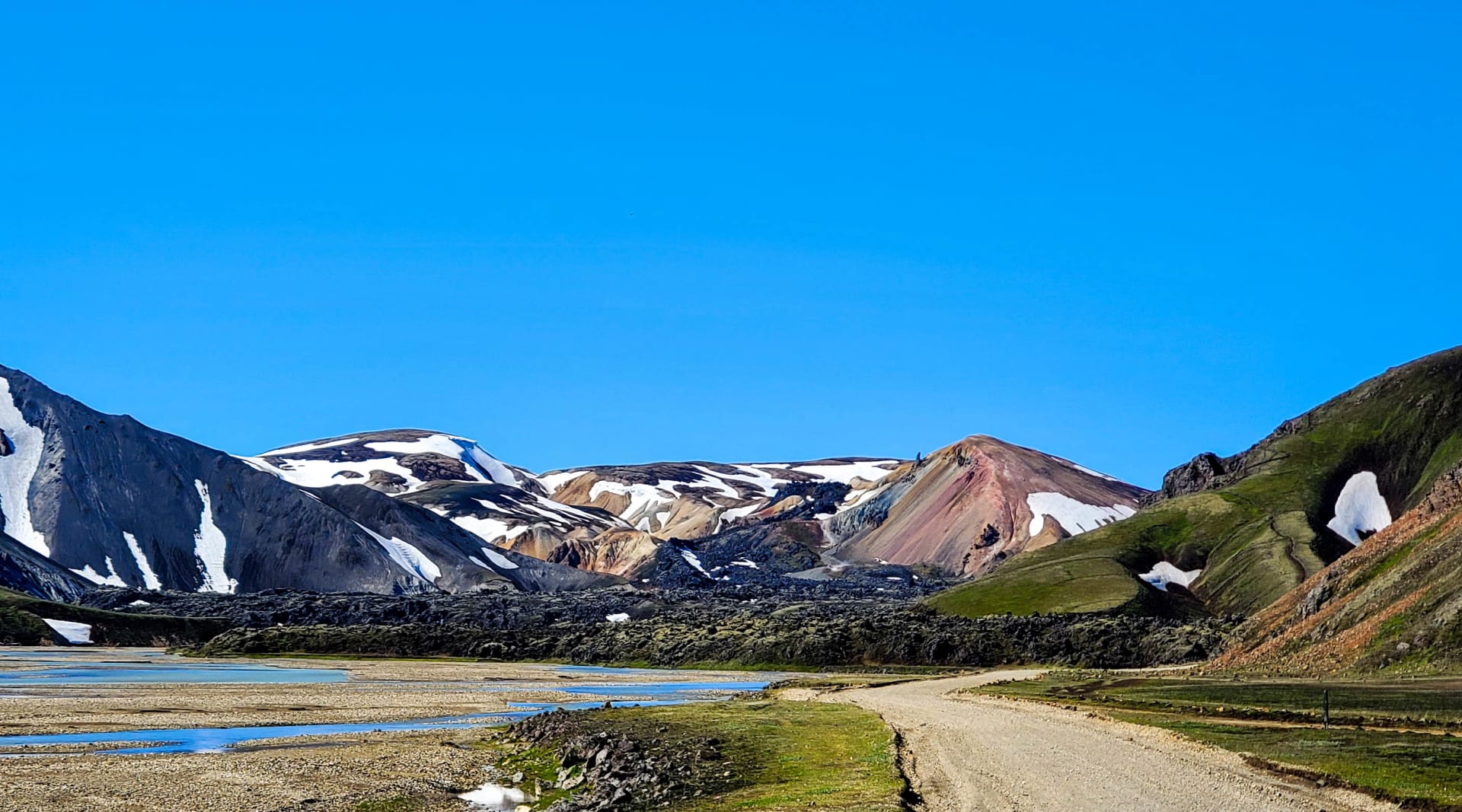 This is the view driving in to Landmannalaugar Bláhnúkur on the left  Laugahraun in the middle and and Brennisteinsalda on the right