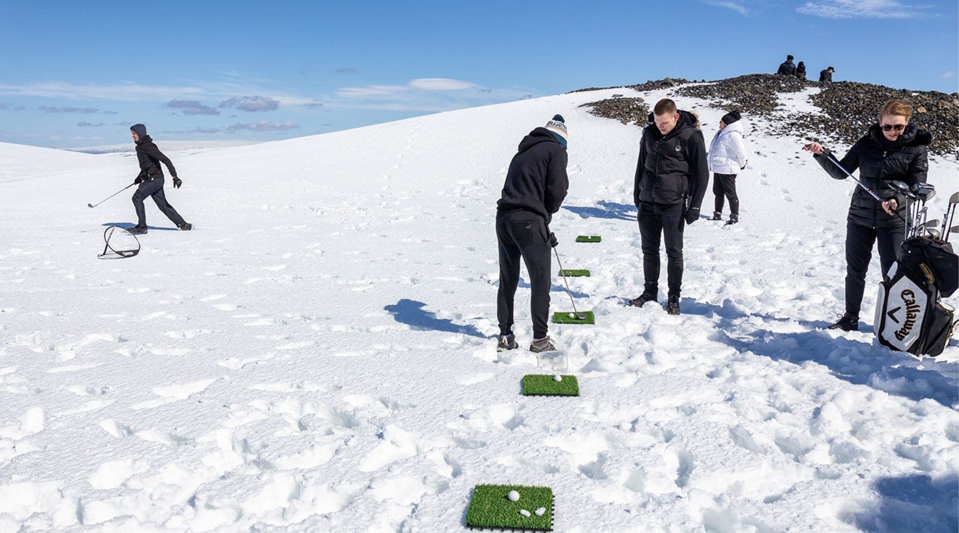 Experience the unique thrill of playing glacier golf atop the icy expanse.