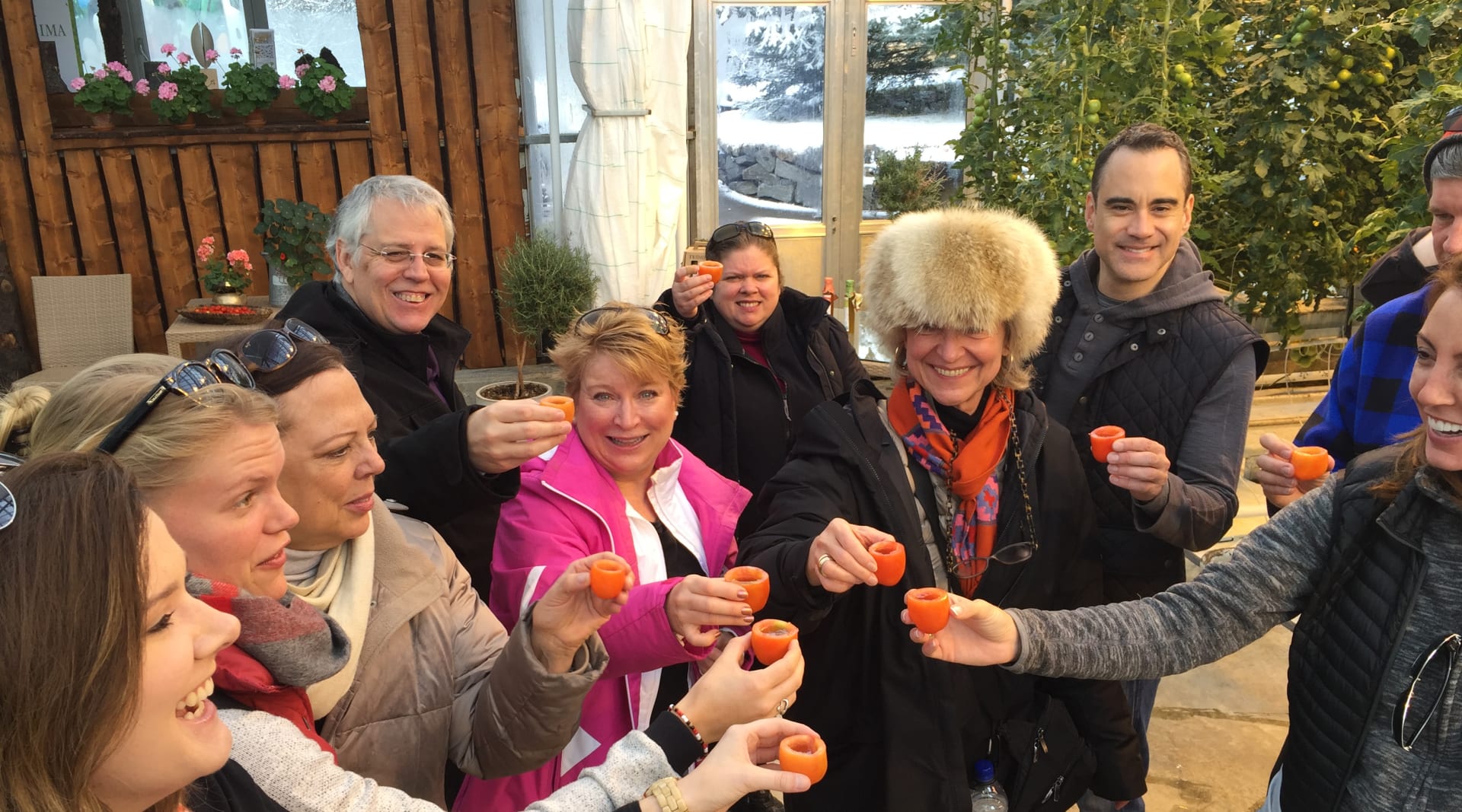 Making a toast with tomato glasses