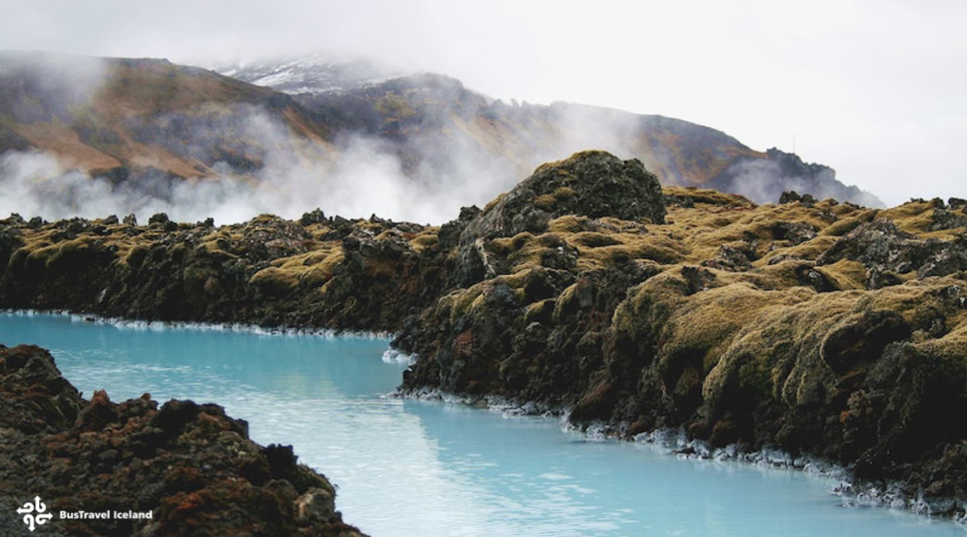 Blue water through lava fields