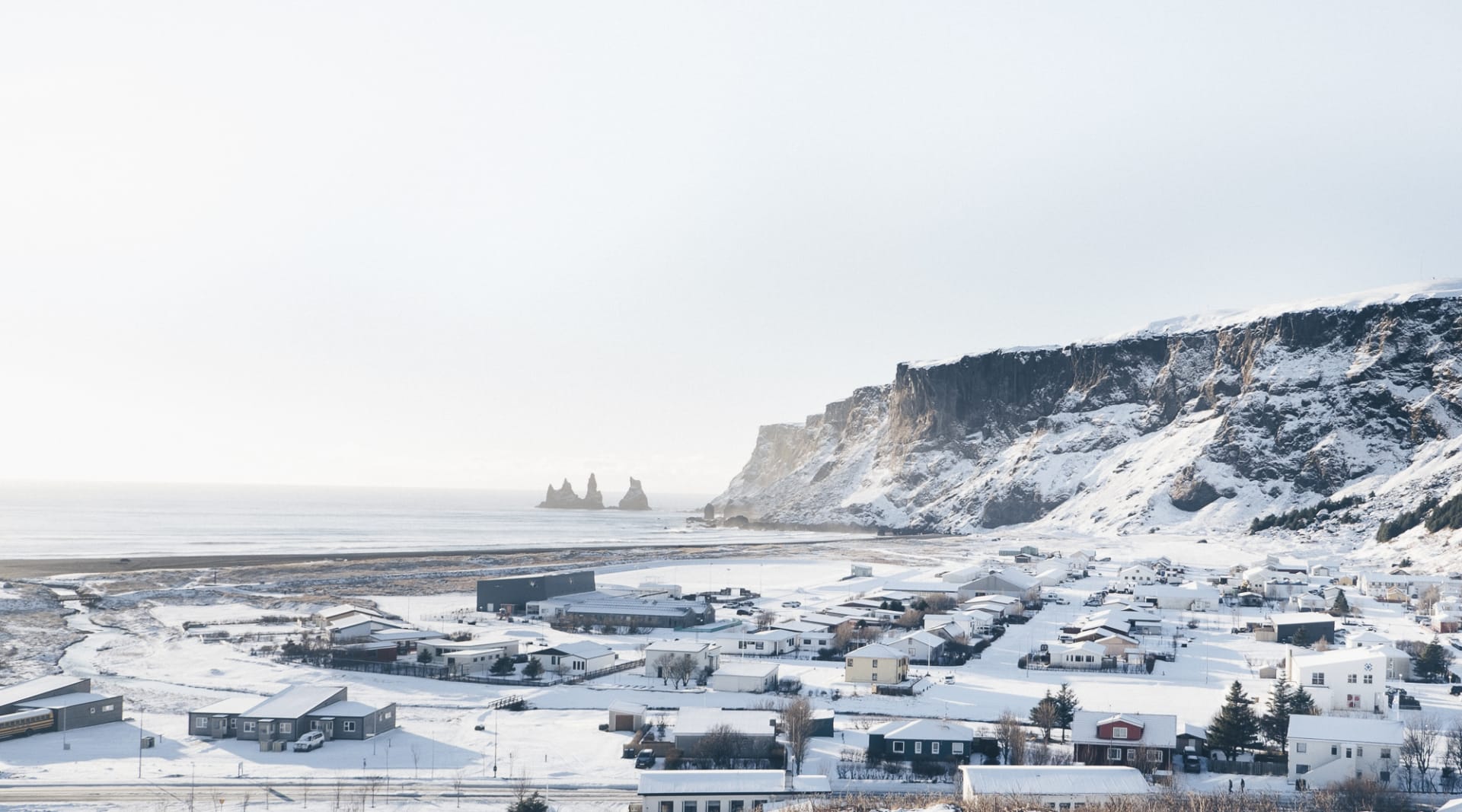 Looking over the village of Vík and Reynisdrangar seastacks