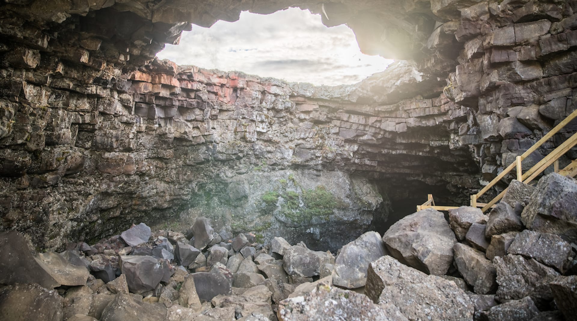 The upper echelons of Víðgelmir present a clear view of the outside world - the last place where light can enter the cave.