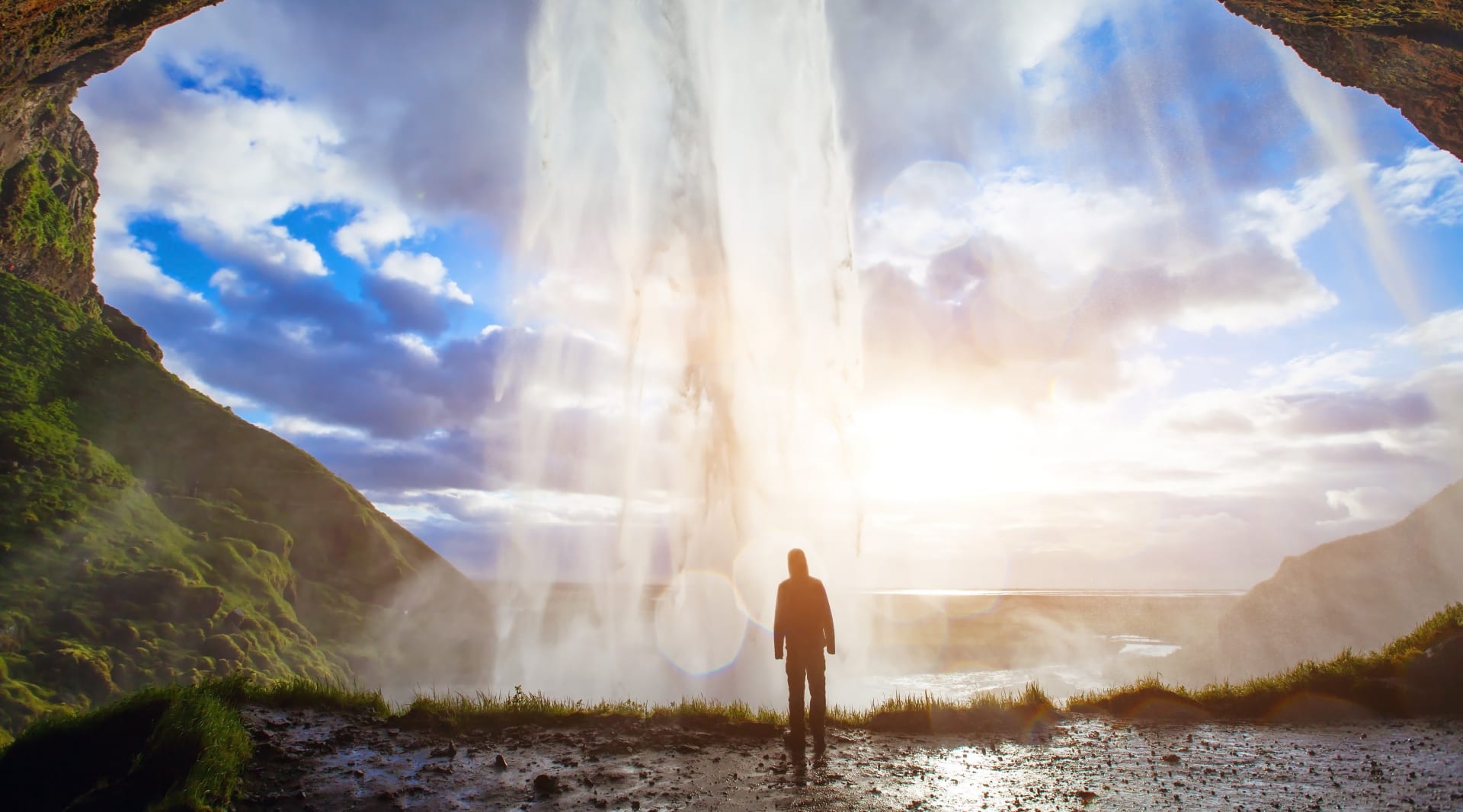 Seljalandsfoss Waterfall with Man behind Waterfall 