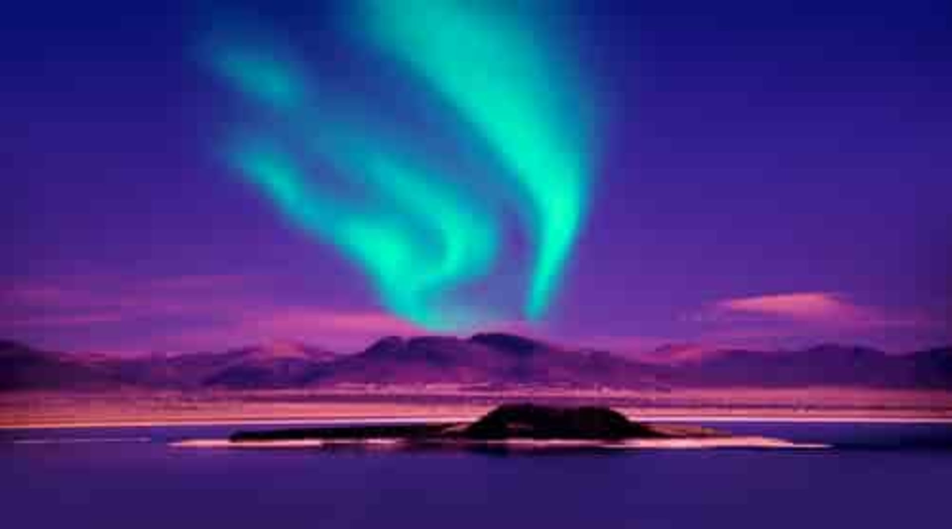 Northern Lights over Mountain overlooking lake in Iceland