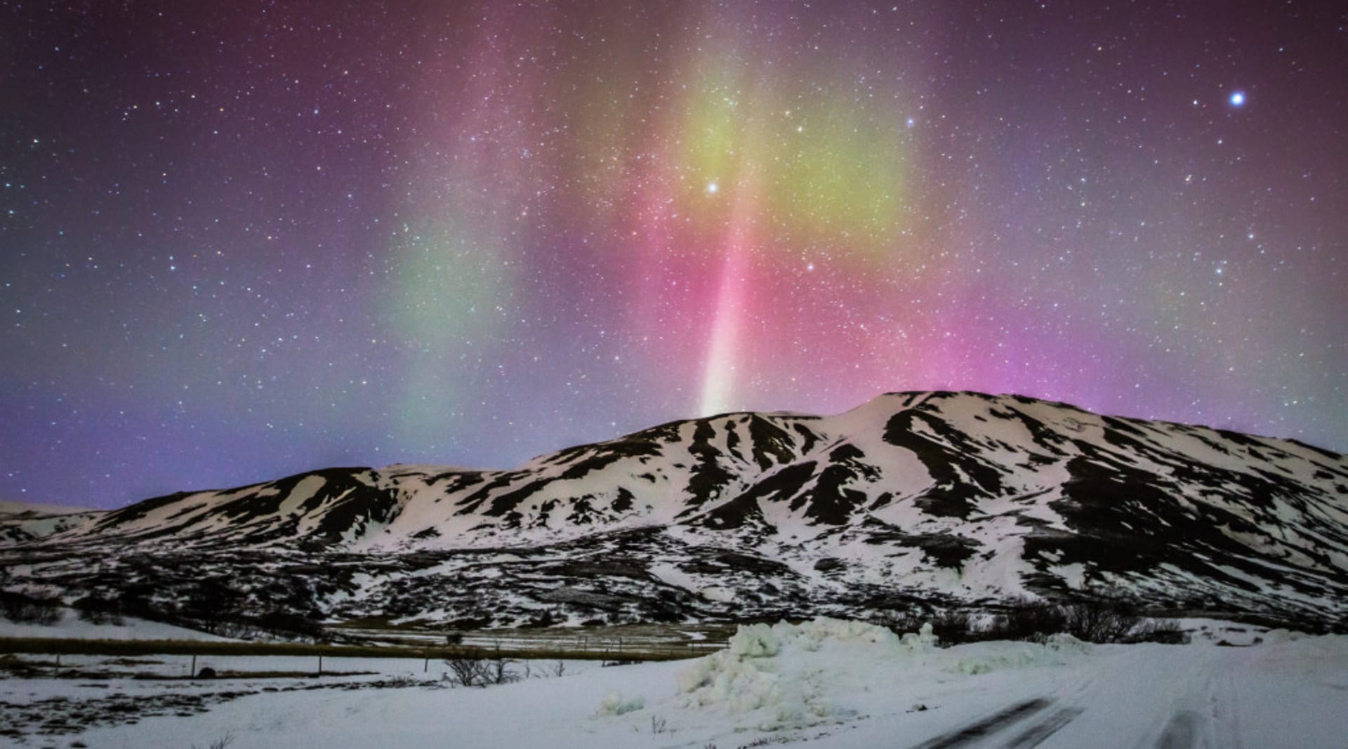 Northern Lights over Mountain In Iceland