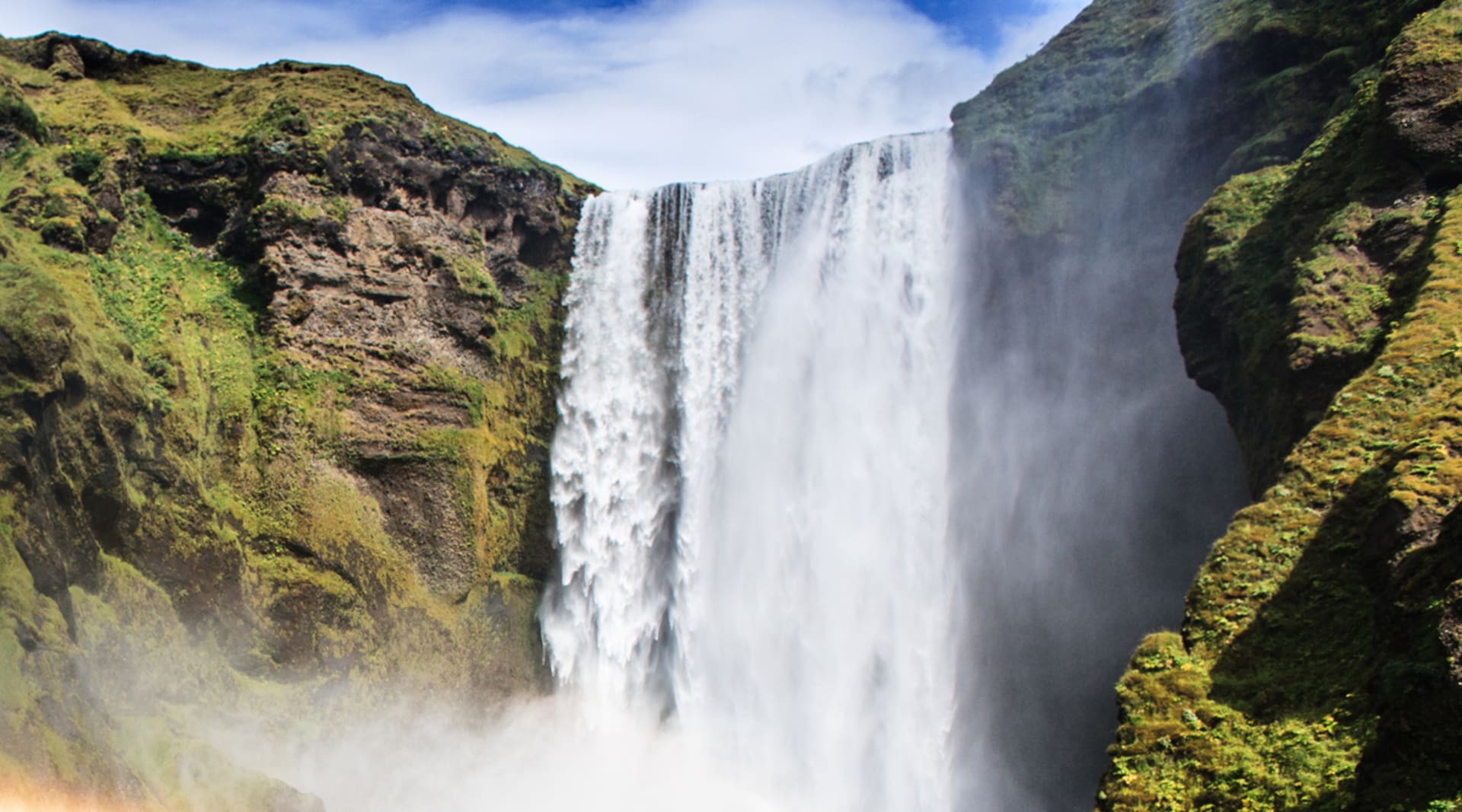 Skogarfoss Waterfall in Summer with Green plants around