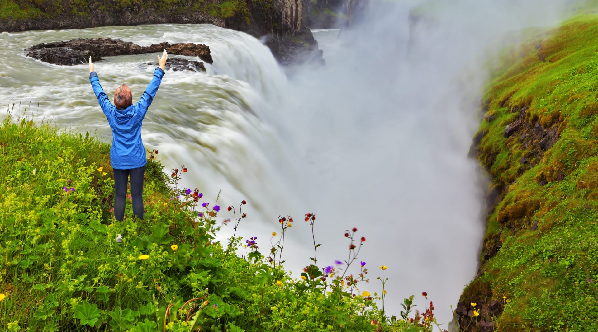 Gullfoss in Iceland with happy woman in front