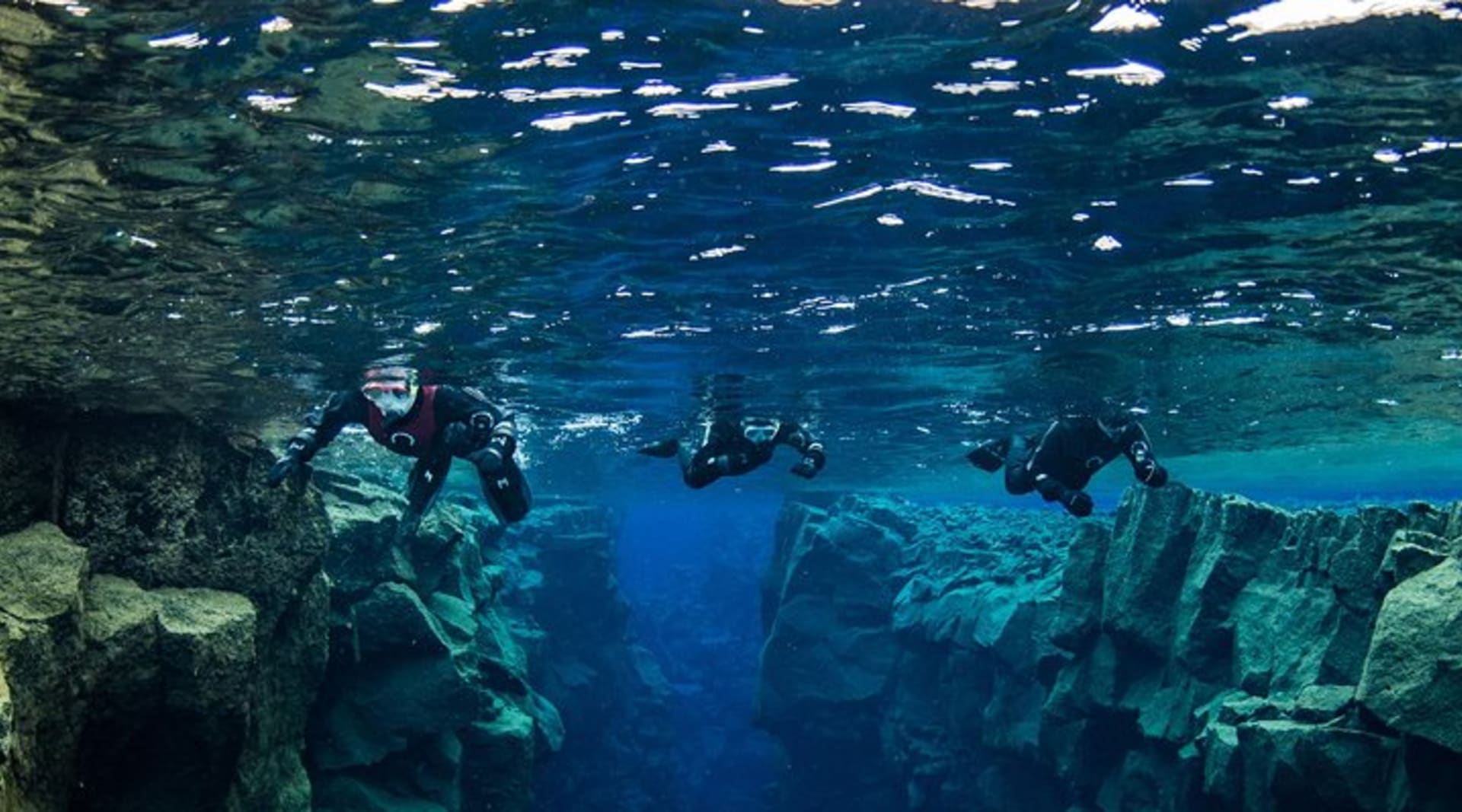 Snorkelers on top of Silfra fissure