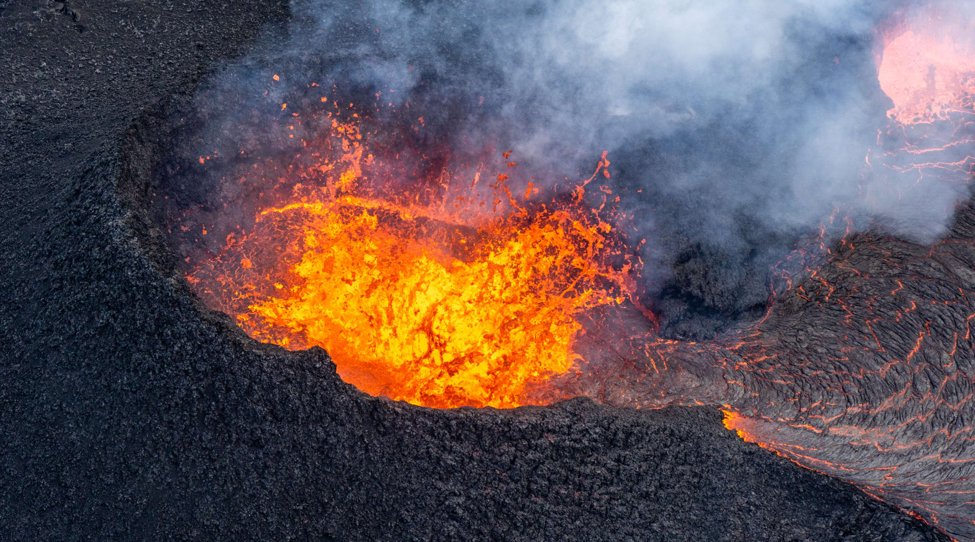 Volcanic crater bubbling with lava