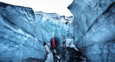 Thumbnail about Mother and son standing outside of an ice cave