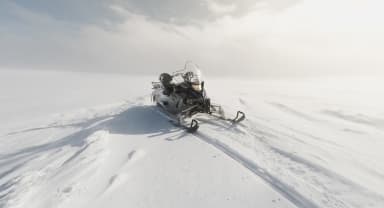 Thumbnail about Snowmobile on the Glacier.