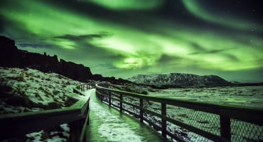 Thumbnail about Northernlights overtaking the sky at Thingvellir National Park